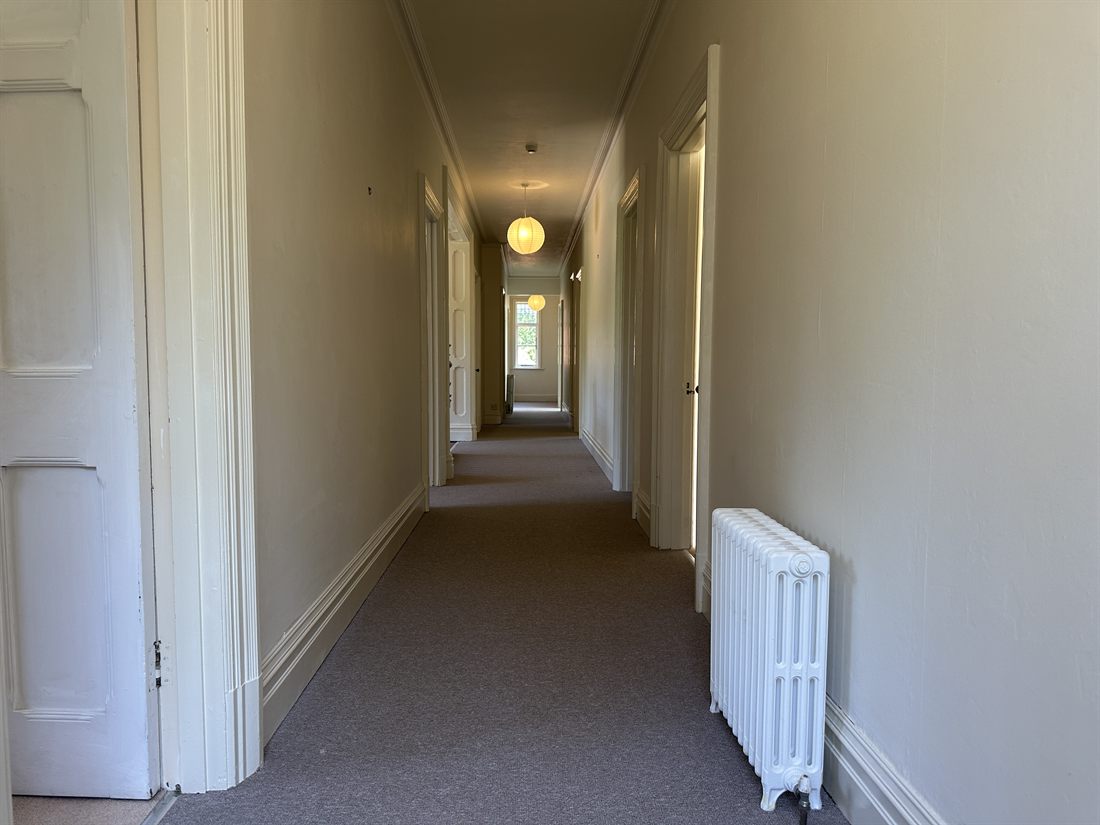 Empty upstairs bedroom corridor