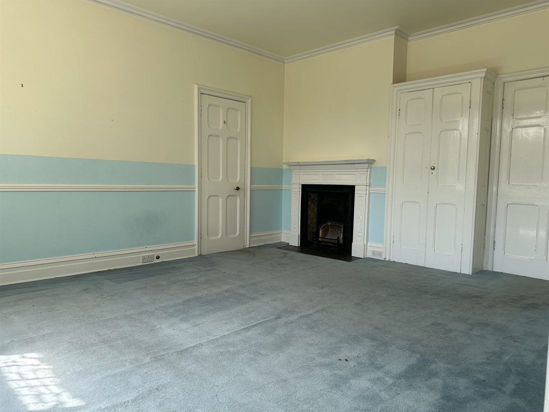 Victorian bedroom with cast-iron fireplace