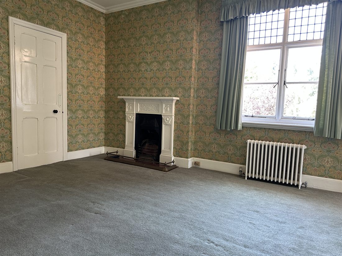 Victorian bedroom with William Morris wallpaper