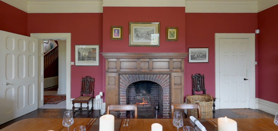 Red Victorian dining room with fireplace