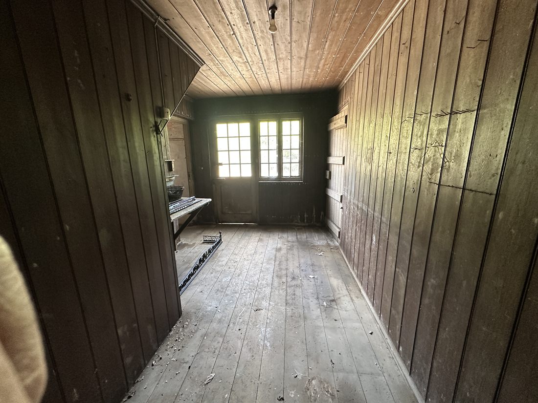 Timber-panelled outbuilding room